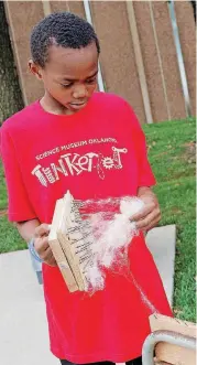  ?? [PHOTO PROVIDED] ?? A child works with alpaca fiber during the 2017 Tinkerfest at Science Museum Oklahoma.
