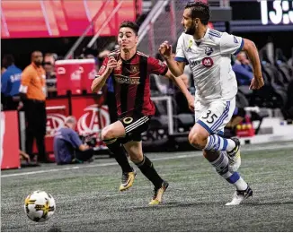  ?? CONTRIBUTE­D BY BRANDEN CAMP ?? Midfielder Miguel Almiron (pushing the ball past Montreal’s Deian Boldor in Sunday’s game) has played full games for a large portion of Atlanta United’s season — even in blowouts.