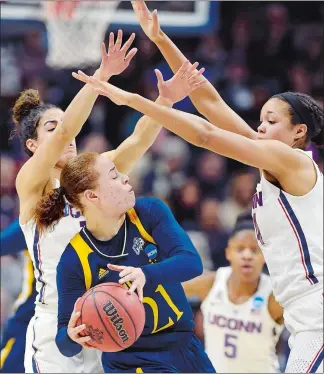  ?? SEAN D. ELLIOT/THE DAY ?? UConn’s Kia Nurse, left, and Napheesa Collier, right, pressure Quinnipiac’s Jen Fay (21) in the first half of Monday’s NCAA tournament game at Gampel Pavilion in Storrs. UConn won 71-46.