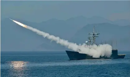  ?? ?? A Taiwanese navy frigate launches a US-made missile during a drill in 2022. Photograph: AFP/Getty Images