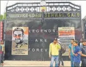  ?? PTI ?? Fans in front of the Virender Sehwag Gate at the Ferozeshah Kotla after its inaugurati­on on Tuesday.