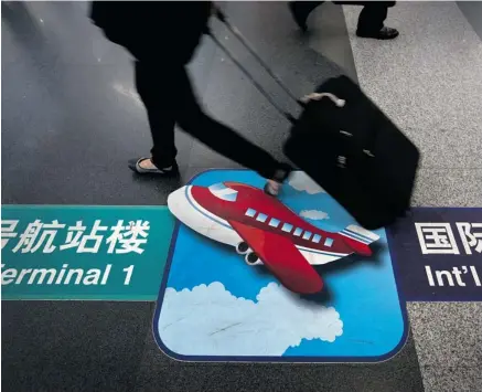  ?? ANDY WONG / THE ASSOCIATED PRESS FILES ?? The cost of airfares in China is expected to rise 7% as the middle class travels more and thereby puts pressure on the country’s airline capacity.