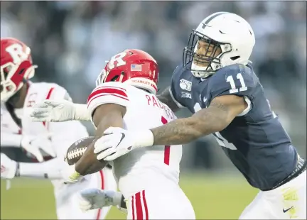  ?? BARRY REEGER — THE ASSOCIATED PRESS ?? In this Nov. 30, 2019, file photo, Penn State linebacker Micah Parsons (11) tackles Rutgers tight end Johnathan Lewis (11) in the first quarter of an NCAA college football game, in State College, Pa. Penn State All-American Micah Parsons is opting out of the 2020 season because of concerns about COVID-19.