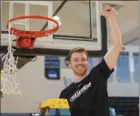  ?? SUBMITTED PHOTO — COURTESY OF SWARTHMORE ATHLETICS ?? Swarthmore forward Michael Caprise cuts down the nets after the Garnet defeated Johns Hopkins in the Centennial Conference final last week.