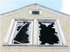  ?? MICHAEL BELL ?? Second story windows were shattered at 1729 Connaught Street, where a fire broke-out and where a man was found deceased.