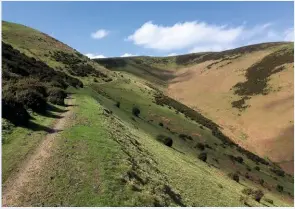  ??  ??  BATCH OF THE DAY The gentle climb up through Small Batch leads past Grindle and Callow and into the vast upland of the Long Mynd. Old English Caratacus, Latin Caractacus, Welsh Caradoc. Thus Caer Caradoc means ‘stronghold of Caractacus’.