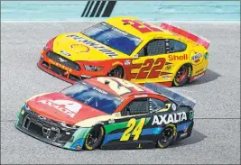  ?? Wilfredo Lee The Associated Press ?? Joey Logano, top, and William Byron battle during Sunday’s Cup Series race. Byron was a winner in crew chief Rudy Fugle’s third race with the team.