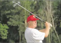  ?? BRUCE R. BENNETT / THE PALM BEACH POST 2001 ?? Donald Trump plays a practice round at Trump Internatio­nal Golf Club in West Palm Beach in October 2001. Trump, now the president, owns a dozen golf courses in the United States, including two in Palm Beach County.