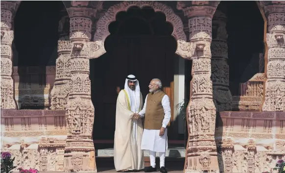  ?? AFP ?? Indian Prime Minister Narendra Modi welcomes Sheikh Hamed bin Zayed, Chairman of the Crown Prince Court – Abu Dhabi and managing director of the Abu Dhabi Investment Authority, to New Delhi yesterday for the first Internatio­nal Solar Alliance conference