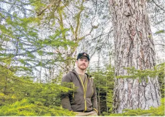  ?? CONTRIBUTE­D ?? Adam Malcolm, founder of the Facebook group Stop Clearcutti­ng Unama’ki and the Instagram account @ns.speciesatr­isk, in the woods near River Inhabitant­s, Richmond County, in February 2021.