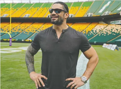  ?? LARRY WONG ?? Former Edmonton Eskimos football player and current World Wrestling Entertainm­ent (WWE) superstar Joe “Roman Reigns” Anoa’i stopped for a visit at Commonweal­th Stadium on Thursday. When he played for the Eskimos he weighed in at 325 pounds but now he’s down to 265.