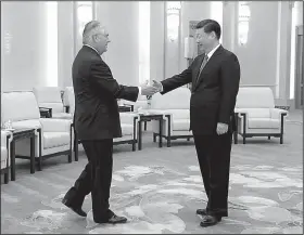  ?? AP/LINTAO ZHANG ?? U.S. Secretary of State Rex Tillerson (left) greets China’s President Xi Jinping at the Great Hall of the People on Sunday in Beijing.