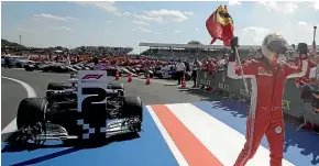  ?? AP ?? Sebastian Vettel celebrates after winning the British Grand Prix.