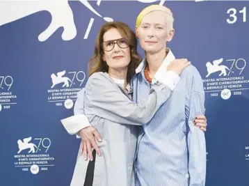  ?? JOEL C RYAN/INVISION ?? Director Joanna Hogg, left, and Tilda Swinton pose Sept. 6 at the Venice Film Festival in Venice, Italy.