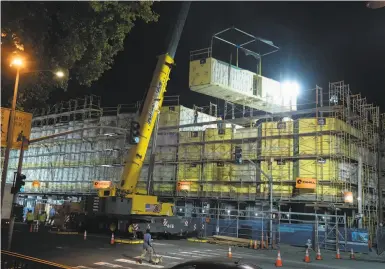  ?? Photos by Paul Kuroda / Special to The Chronicle ?? Vallejobui­lt modular boxes hoisted into position in October will soon be housing beside the Hall of Justice.