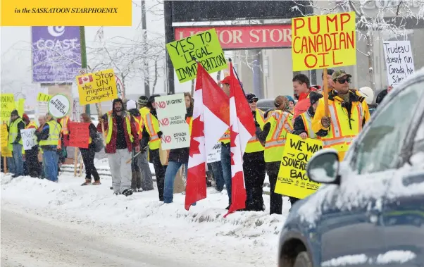  ?? MURRAY MITCHELL / THE ASSOCIATED PRESS ?? Protesters line the road in Kamloops, B.C., where Prime Minister Justin Trudeau spoke at a Liberal fundraiser Wednesday in a fractious climate over energy pipelines.