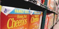  ?? — AFP ?? Boxes of Cheerios cereal are seen in a grocery shop in New York.