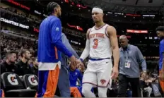  ?? Mark Black/Associated Press ?? The Knicks’ Josh Hart walks off the court after being ejected from the game against the Bulls during the first quarter in Chicago on Friday.