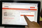  ?? EKO PRIYONO/JAWA POS ?? MEMUDAHKAN: Website pengecekan dan pembayaran tilang.