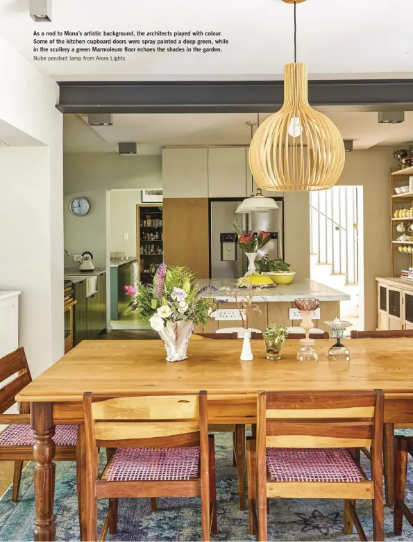  ??  ?? As a nod to Mona’s artistic background, the architects played with colour. Some of the kitchen cupboard doors were spray painted a deep green, while in the scullery a green Marmoleum floor echoes the shades in the garden. Nube pendant lamp from Arora Lights