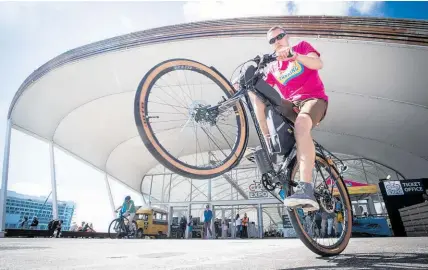  ?? Photo / Jason Oxenham ?? Michael Lawton trials a bike in the sun at the eBike Expo at The Cloud in Auckland yesterday.