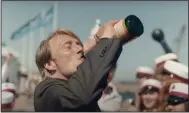  ??  ?? The usually sober Mads Mikkelsen drinks and ultimately dances his way through “Another Round,” one of the highlights of this year’s Toronto Internatio­nal Film Festival, which U.S. critics attended virtually.