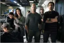  ?? WARNER BROS. PICTURES ?? Page Kennedy, foreground left, Ruby Rose, Li Bingbing, Jason Statham and Cliff Curtis appear in a scene from the “The Meg.”