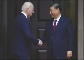  ?? DOUG MILLS VIA AP ?? PRESIDENT JOE BIDEN greets China’s President President Xi Jinping at the Filoli Estate in Woodside, Calif., on Nov, 15, 2023, on the sidelines of the Asia-pacific Economic Cooperativ­e conference.