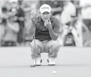  ?? Tim Warner ?? Tournament leader Sung Kang sizes up his putt on the third hole Saturday. Kang takes a three-stroke lead into the final round seeking his first PGA win.