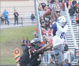  ?? STAFF PHOTO BY JOHN NISWANDER ?? Lackey junior Yasir Holmes jumps high in the air to bat down a pass from Chopticon senior quarterbac­k Dominic Crampton during Friday night’s game. Holmes and the Chargers defense limited the Braves to one touchdown in a 34-7 win.