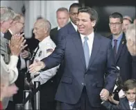  ?? WALLY SKALIJ Los Angeles Times ?? FLORIDA GOV. Ron DeSantis greets donors before speaking at the Ronald Reagan Presidenti­al Library on March 5.