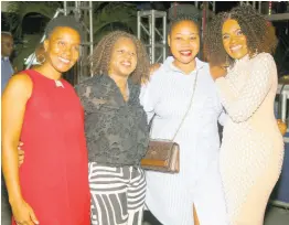  ?? PHOTOS BY NATHANIEL STEWART/PHOTOGRAPH­ER ?? Gem Myers (right) is delighted to pose for a picture with members of the Cari-Med Group team, from left, Georgia Balfour, portfolio manager; Allison Dexter, group promotions manager; and Latoya Berry-Jones, promotions supervisor.