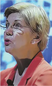  ?? STAFF PHOTO BY CHRISTOPHE­R EVANS ?? THE LATEST SALVO: Sen. Elizabeth Warren speaks last night at Roxbury Community College, calling Donald Trump a ‘racist bully’ and warning voters off from casting ballots for Green Party candidate Jill Stein, saying that would be a net benefit for Trump.