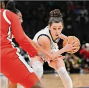  ?? Alika Jenner/Getty Images ?? The University of Connecticu­t’s Lou Lopez Sénéchal looks to drive against Ohio State in a Sweet 16 game in Seattle.