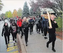  ?? JOHN LAW THE NIAGARA FALLS REVIEW ?? Saint Michael and Saint Paul Catholic high schools participat­e in the 43rd annual Pilgrimage Sunday walk.