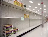  ?? Miami Herald file ?? Empty store shelves can feed anxiety levels. In this Kansas City Target, a sign asks shoppers to limit the quantity of paper towels and toilet paper products they purchase.