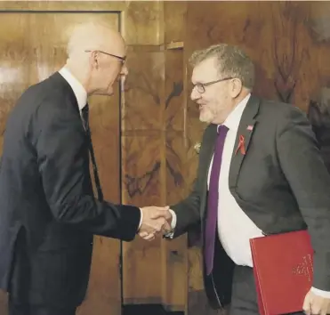  ?? PHOTOGRAPH: JANE BARLOW ?? 0 Deputy First Minister John Swinney, left, greets David Mundell