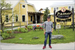  ?? WILSON RING — THE ASSOCIATED PRESS ?? Eduardo Rovetto outside his restaurant Piecasso Pizzeria & Lounge in Stowe, Vt. Rovetto says he would like to hire 15to 20workers before what is expected to be a busy summer tourist season, but he’s not getting enough interest. Similar complaints are heard across the country and many states, including Vermont, are beginning to push those who lost jobs during the pandemic back into the workforce.