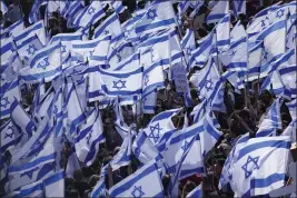  ?? ARIEL SCHALIT — THE ASSOCIATED PRESS ?? Israelis protest against Prime Minister Benjamin Netanyahu's judicial overhaul plan outside the parliament in Jerusalem on Monday.