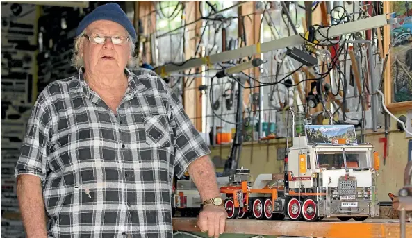  ?? LUKE KIRKEBY/STUFF ?? Tokoroa great grandfathe­r Ken Ward with his model Kenworth truck.