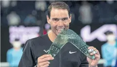  ?? AFP ?? Rafael Nadal celebrates with the Melbourne Summer Set trophy.