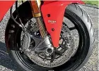  ??  ?? Brembo 4.32 calipers and 320mm diameter discs shared with the 959 Panigale, while Ohlins adaptive front forks reduce dive.