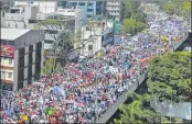  ?? —Manjunath Kiran / AFP ?? Members of the Karnataka private school associatio­ns march on the Anand Rao Circle flyover as they take part in a protest seeking the repeal of the Karnataka government order on tuition fee, in Bangalore on Tuesday.