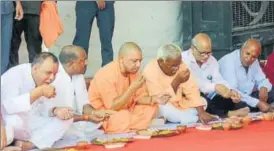  ?? PTI ?? Chief minister Yogi Adityanath having a meal with Dalits after unveiling the statue of Dr BR Ambedkar at Campiergan­j in Gorakhpur on Wednesday.