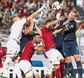  ??  ?? Up for it: England’s Harry Kane (right) going for the ball during the World Cup qualifying match against Malta on Friday. —AP