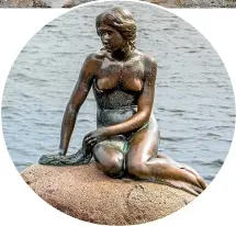  ??  ?? The Little Mermaid is a bronze statue by Edvard Eriksen, depicting a mermaid. The sculpture is displayed on a rock by the waterside at the Langelinie promenade in Copenhagen.