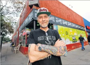  ?? DAVID ZALUBOWSKI/ASSOCIATED PRESS PHOTO ?? Jim Norris poses for a photo outside of his informatio­n cafe called Mutiny in south Denver on Sunday, Aug. 20. Norris is hoping to license his storefront as one of the nation’s first legal marijuana clubs.