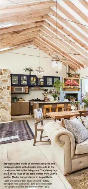  ??  ?? Exposed rafters made of whitewashe­d pine and Indian pendants with dimpled glass add to the farmhouse feel in the living area. The dining room chair at the head of the table comes from Charl’s mother Martie Burger’s home in Leipoldtvi­lle. Table and...