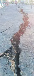  ?? REUTERS ?? A crack emerges on a road at Kayangan Port yesterday after another earthquake hit Lombok, Indonesia.