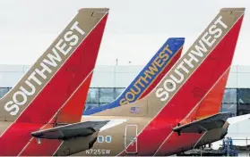  ?? John Gress / Reuters 2006 ?? Southwest Airlines no longer requires customers who show up without having reserved an extra seat to pay for one if staff determines it is needed.